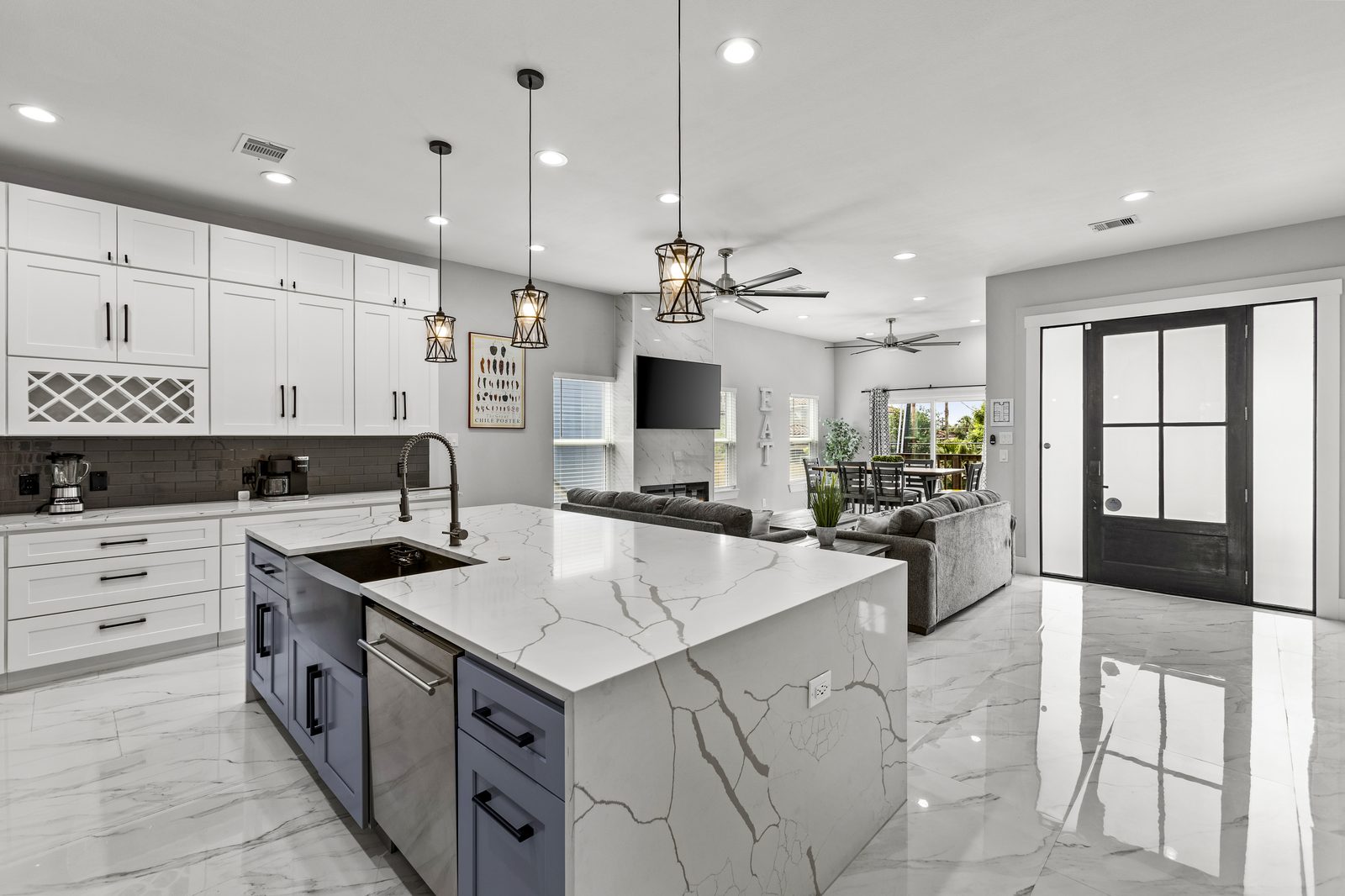 Open kitchen with marble island and family room at Seabrook Escape